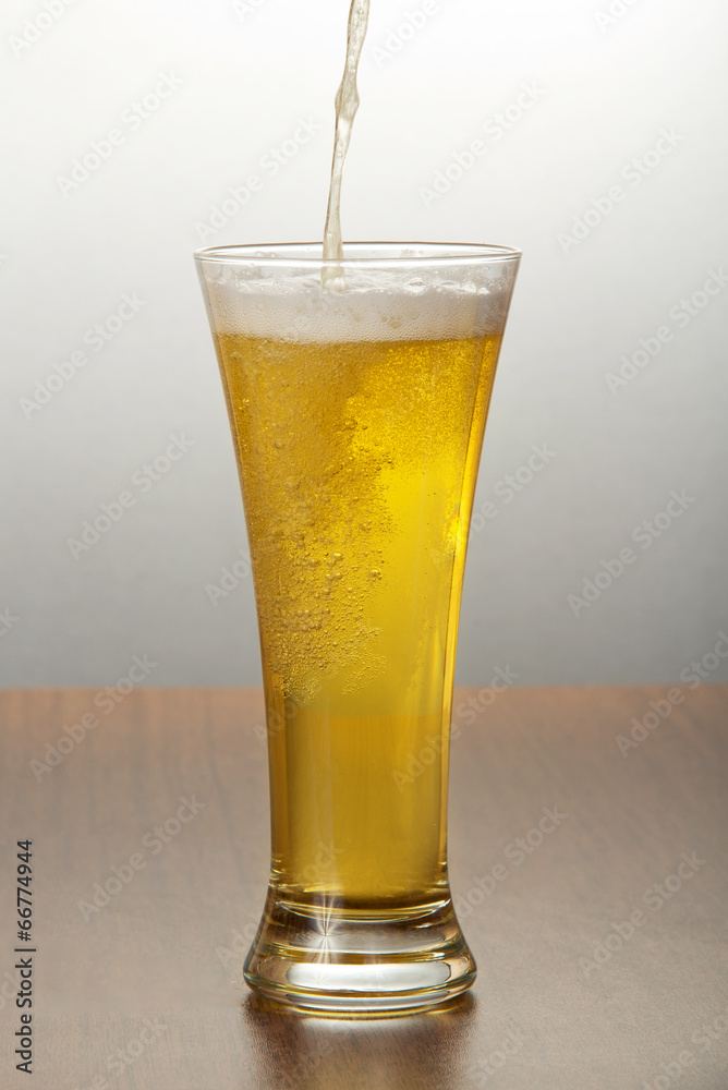 Beer pouring into glass