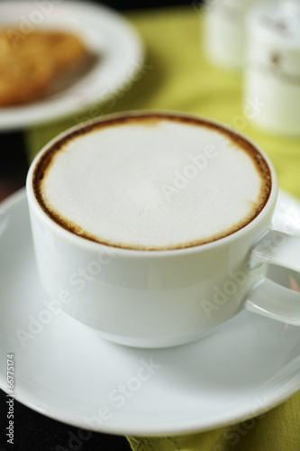 close up hot cappuccino in white cup