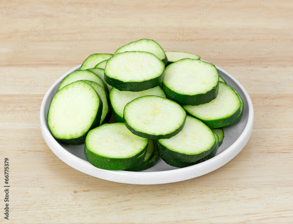 Small dish with slices of summer squash Small dish with slices of summer squash