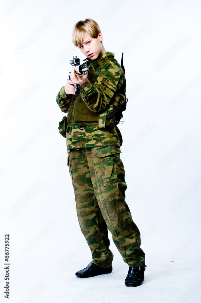 young man in camouflage with a sniper rifle young man in camouflage with a sniper rifle