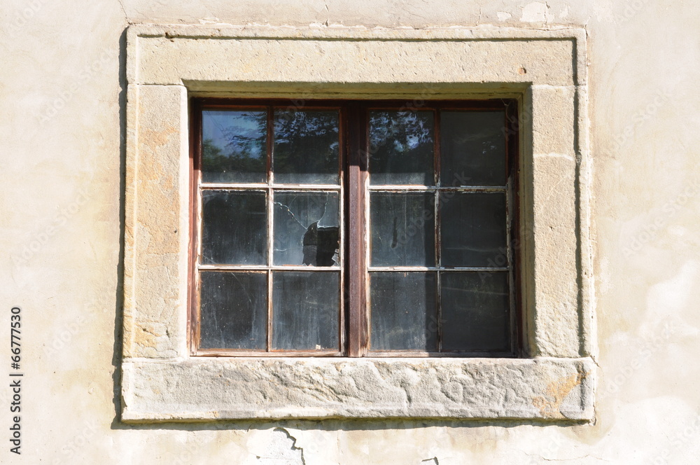 Broken glass in stone window