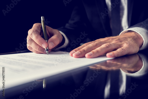 Signing legal document photo