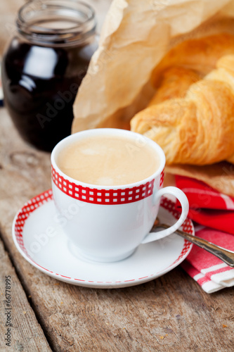 Breakfast setting  cup of coffee and croissants
