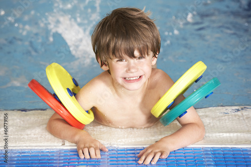 Young boy in swimming pool