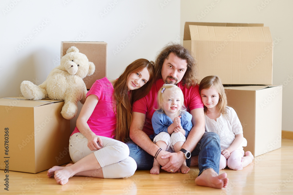 Fototapeta premium Happy young family in their new home