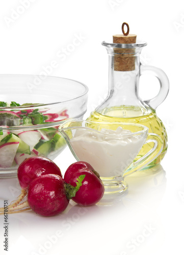 Salad in a bowl, sunflower oil and the sour cream