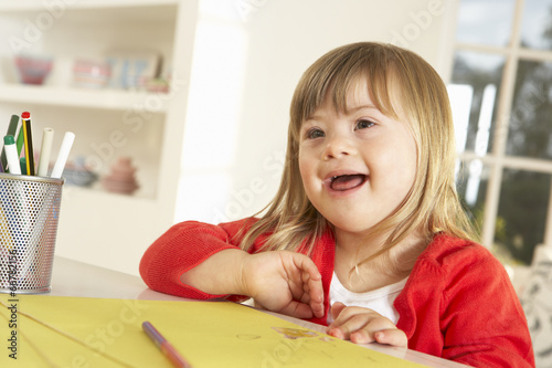 Girl with Downs Syndrome drawing