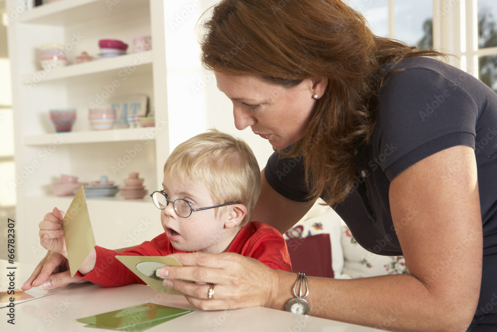 Downs Syndrome boyhaving speech therapy Downs Syndrome boyhaving speech therapy