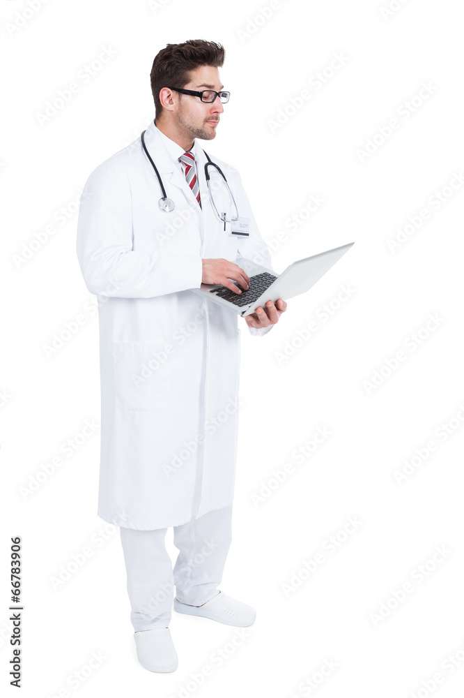 Doctor Using Laptop Over White Background Doctor Using Laptop Over White Background
