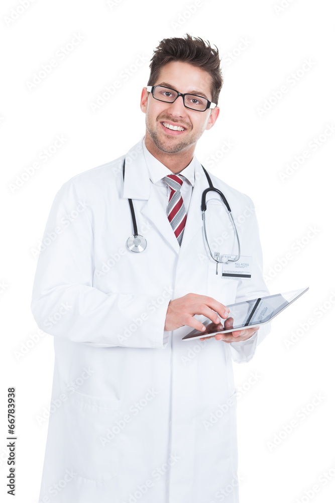 Smiling Male Doctor Using Digital Tablet Smiling Male Doctor Using Digital Tablet