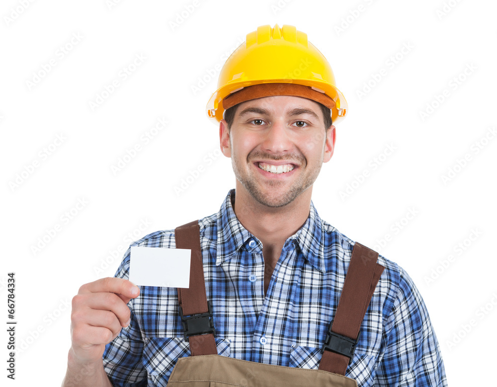 Confident Young Manual Worker Giving Visiting Card Confident Young Manual Worker Giving Visiting Card