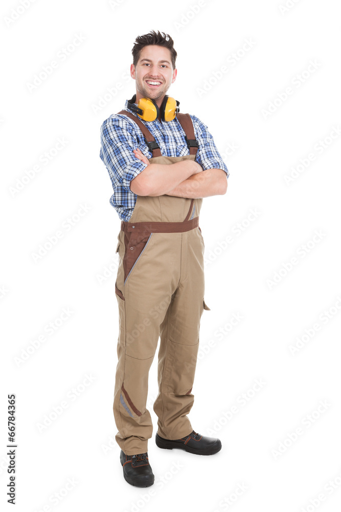 Smiling Worker Standing Arms Crossed Over White Background Smiling Worker Standing Arms Crossed Over White Background