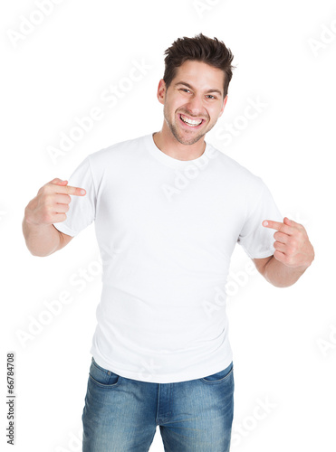 Smiling Young Man Pointing Itself photo