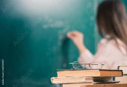 teacher books and glasses closeup