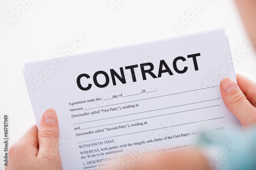 Woman Reading Contract Paper