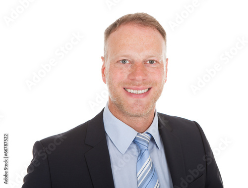Confident Young Businessman Smiling