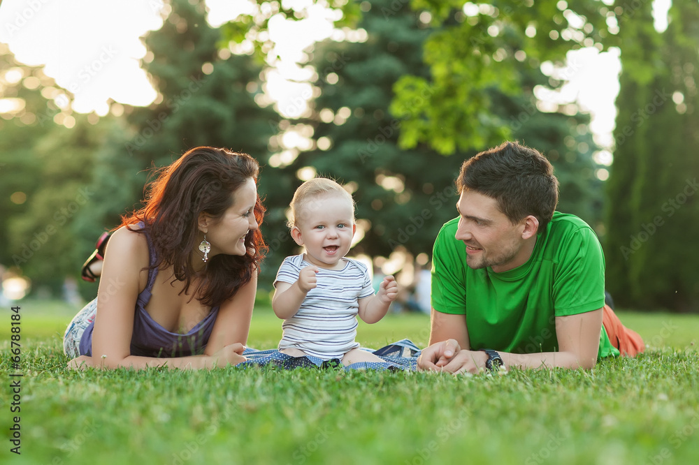 Young Attractive Parents and Child Portrait Outdoors Young Attractive Parents and Child Portrait Outdoors
