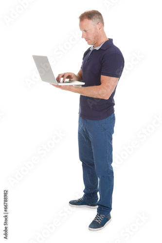 Man Using Laptop Over White Background