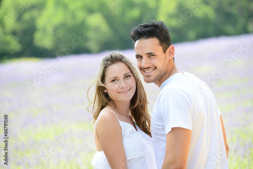 young couple man woman summer holiday lavender field provence