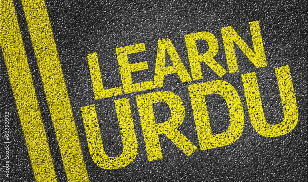 Obraz premium Learn Urdu written on the road