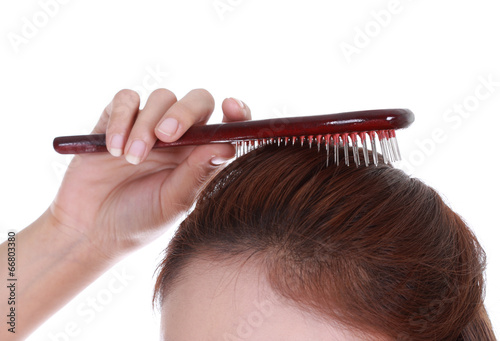 woman brushing her hair