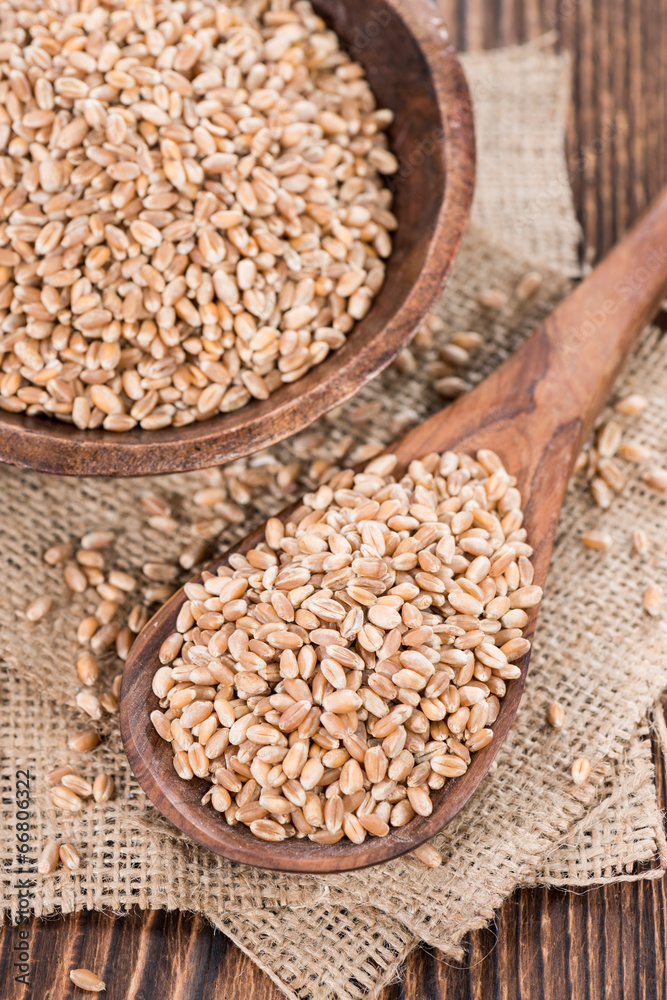 Wheat Grains on wooden table Wheat Grains on wooden table