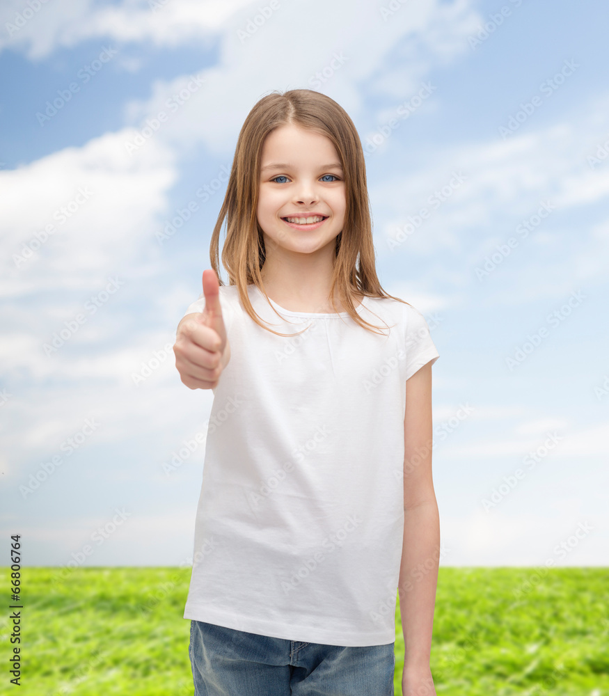 girl in blank white t-shirt showing thumbs up girl in blank white t-shirt showing thumbs up