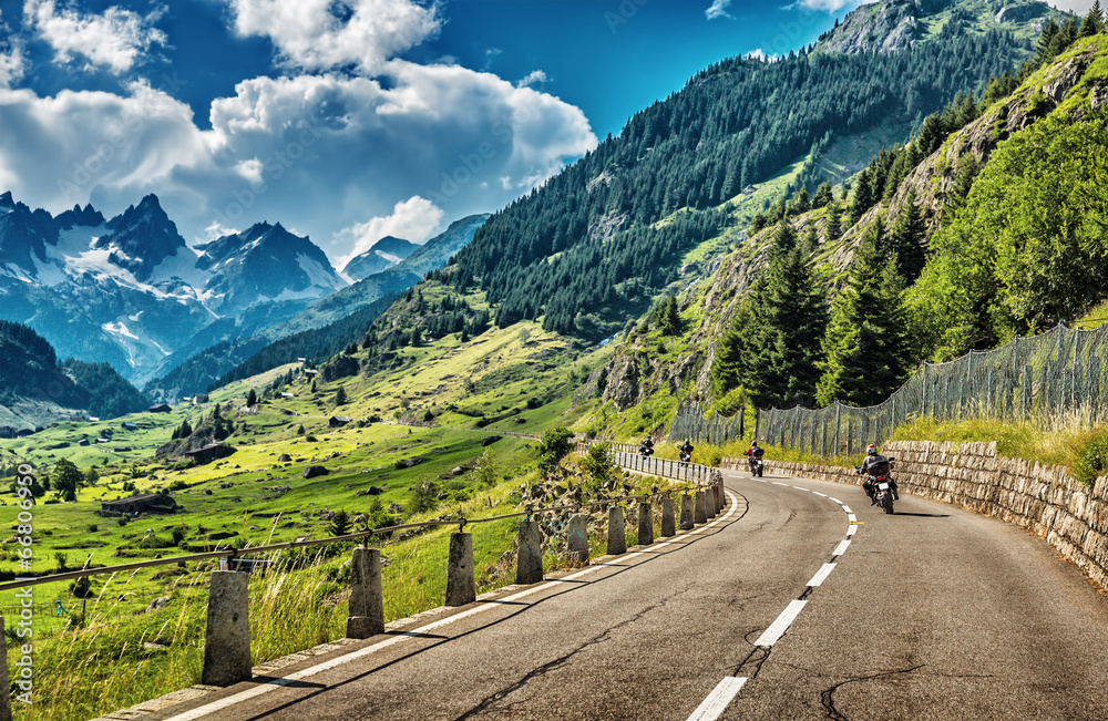 Group of bikers touring European Alps