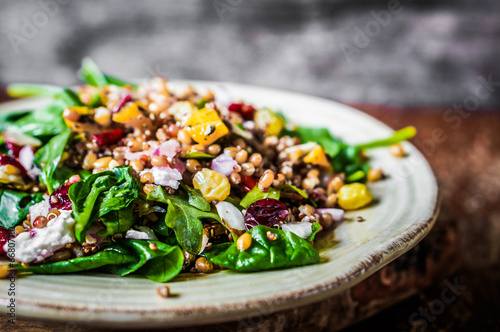 Healthy salad with spinach,quinoa and roasted vegetables