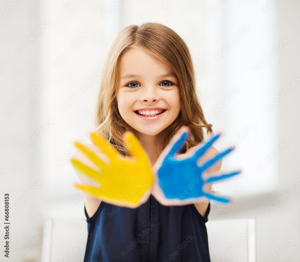 girl showing painted hands