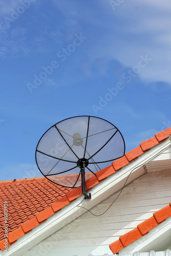 Satellite dish with sky on roof