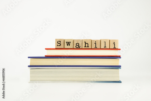 swahili language word on wood stamps and books
