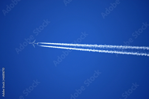 airplane and vapour trail