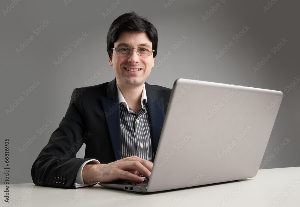 Busy businessman in office working on his laptop Busy businessman in office working on his laptop