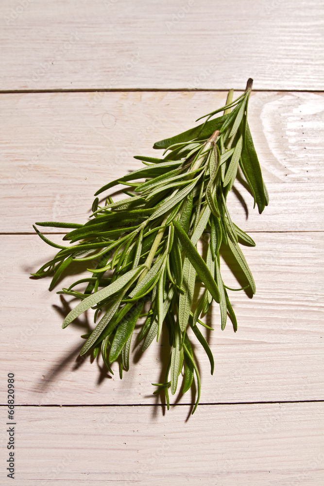 rosemary, pepper and allspice on rustic wooden table rosemary, pepper and allspice on rustic wooden table