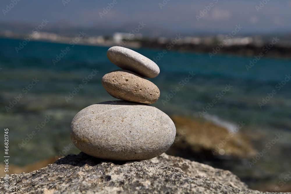 stack of stone on sea shore closeup. stack of stone on sea shore closeup.