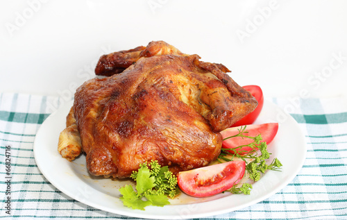 Roasted chicken seasoned with tomatoes