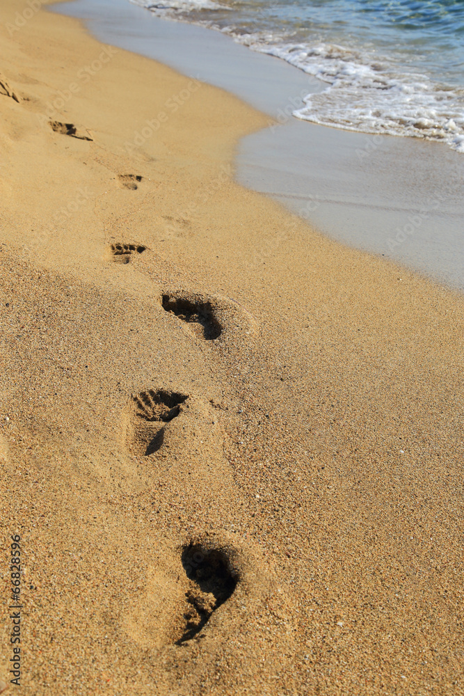Sandy shoreline with footprints Falasarna Crete Sandy shoreline with footprints Falasarna Crete