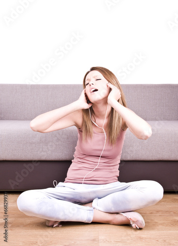 young girl relaxing and listening a music 
