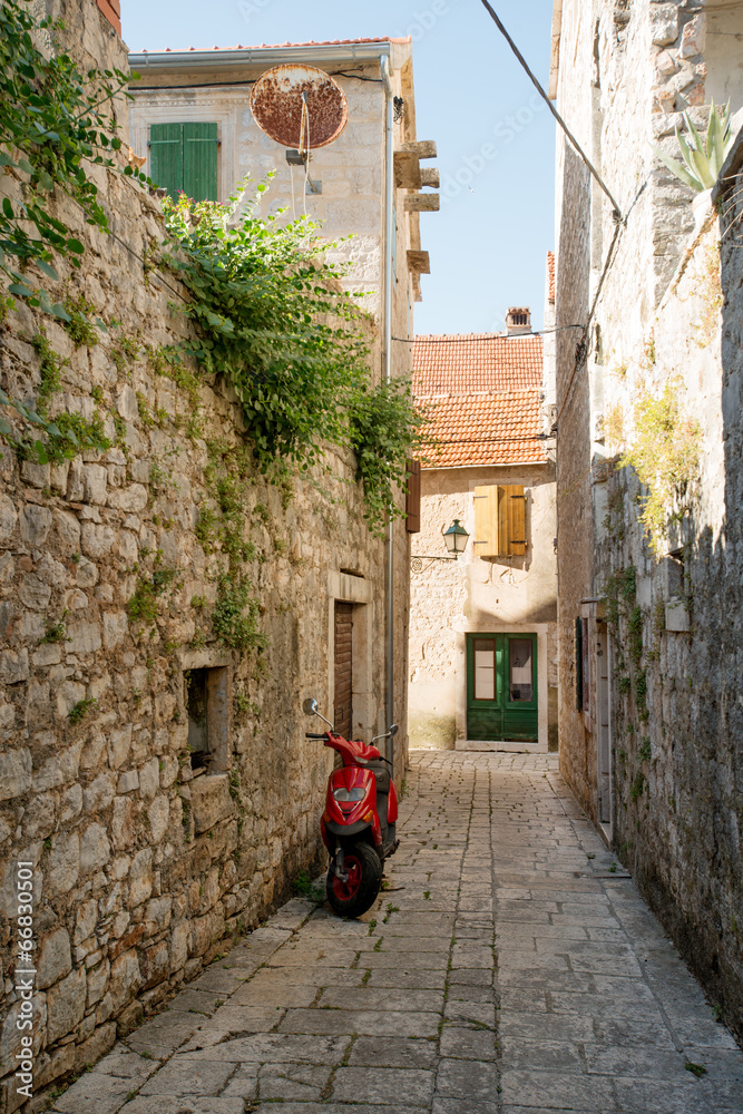 Narrow street of historic Stari Grad, Hvar island, Croatia