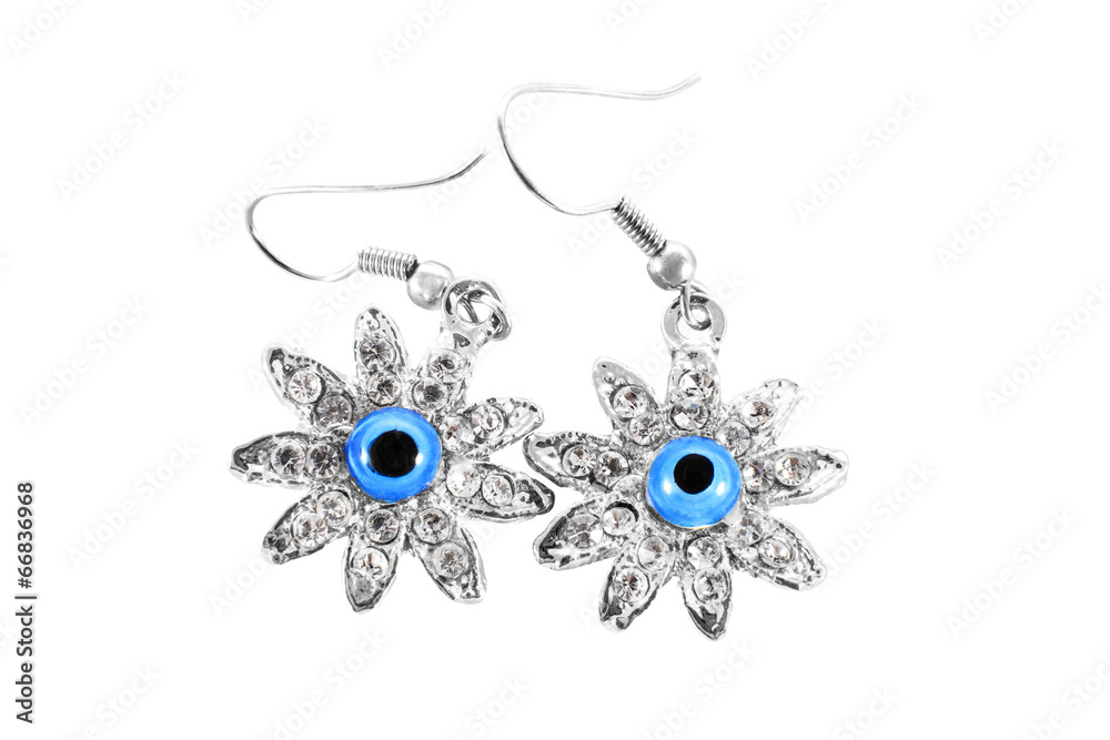 silver earrings with stones in a daisy