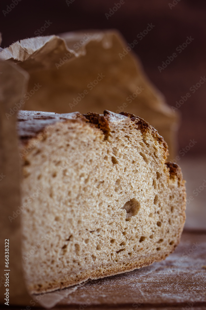 rustic rye bread on wooden board. Selective focus. rustic rye bread on wooden board. Selective focus.