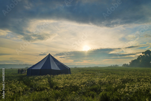 People near Big tent in foggy dream landscape © ivan604