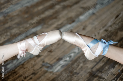 Pointed feet in ballet shoes photo