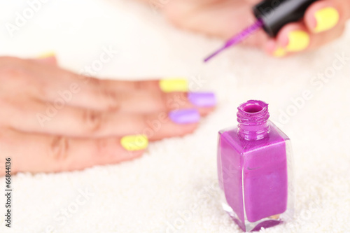 Female hands with stylish colorful nails and nail polish