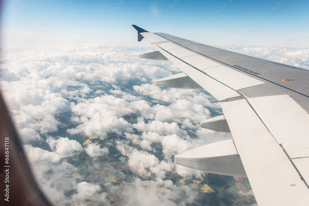 Airplane wing out of window Airplane wing out of window