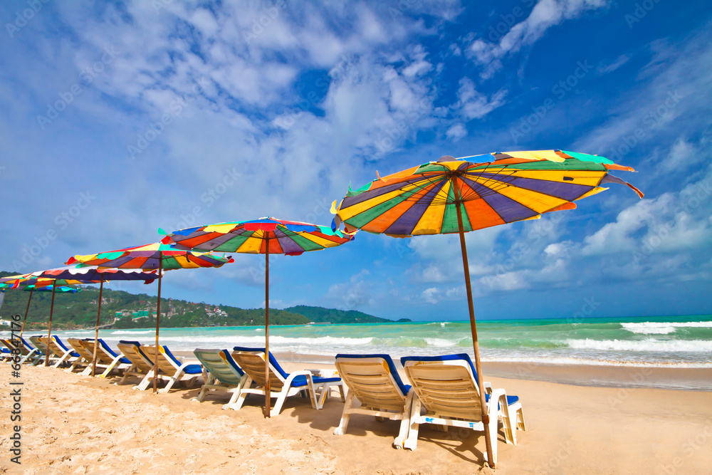 Beach chairs and colorful umbrella on the beach Beach chairs and colorful umbrella on the beach