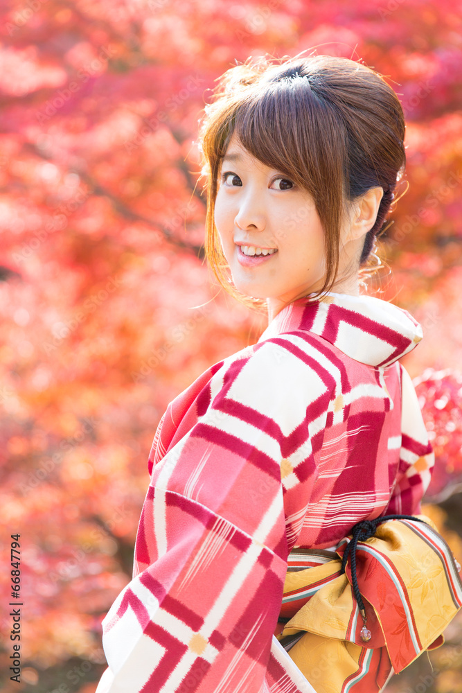 asian woman wearing japanese kimono in fall