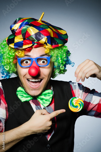 Funny clown with sweet lollipop