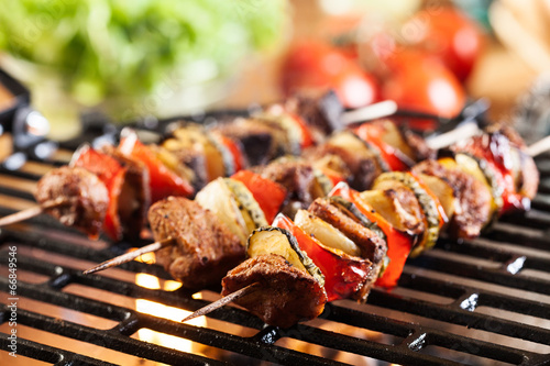 Fényképezés Grilling shashlik on barbecue grill